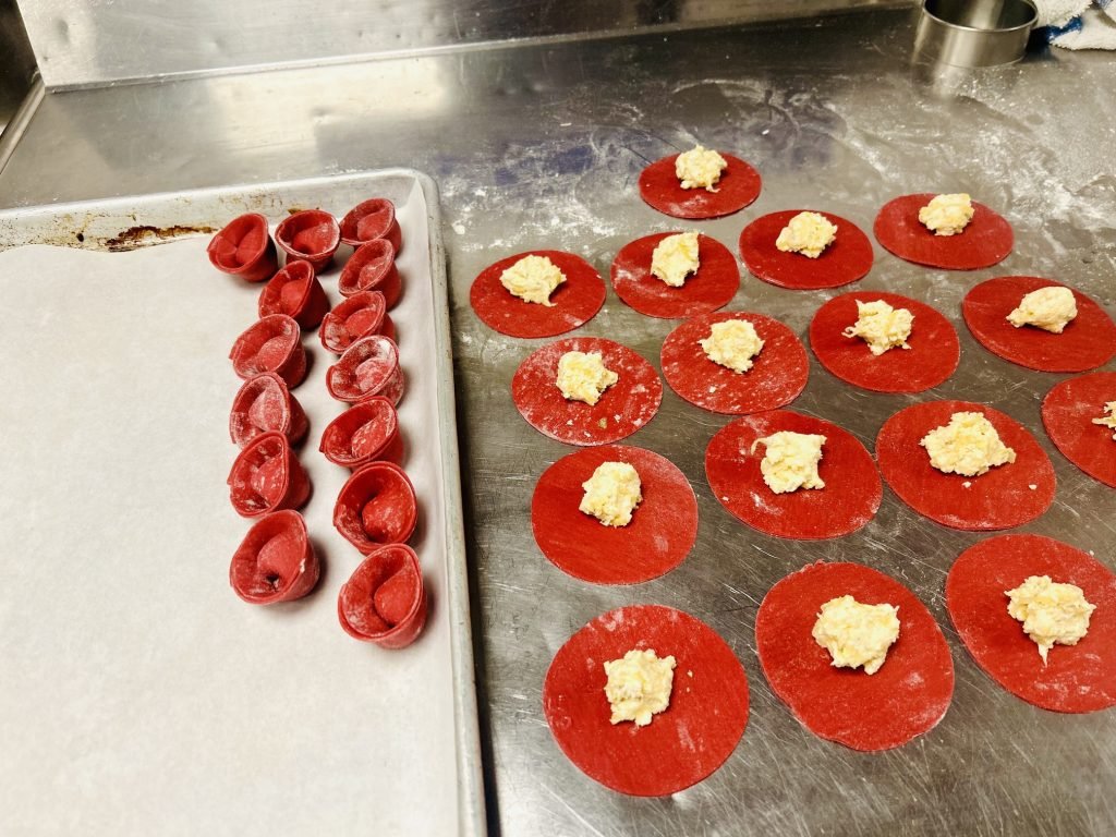 Tomato canapés being plated in the kitchen