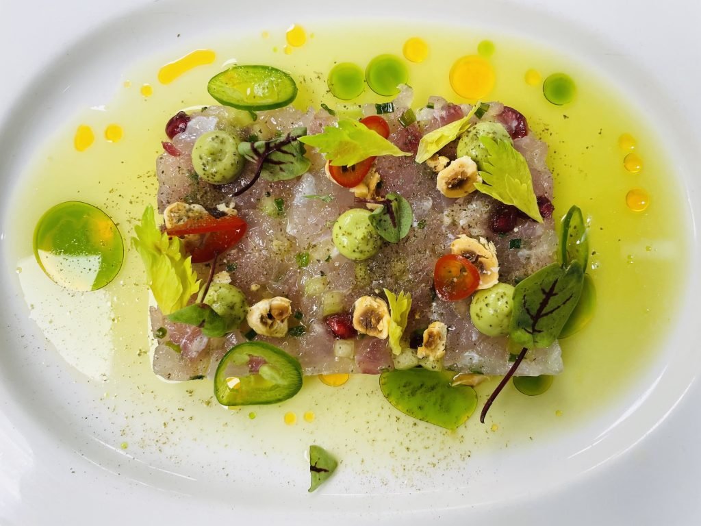 Cured fish with herb oil and summer vegetables