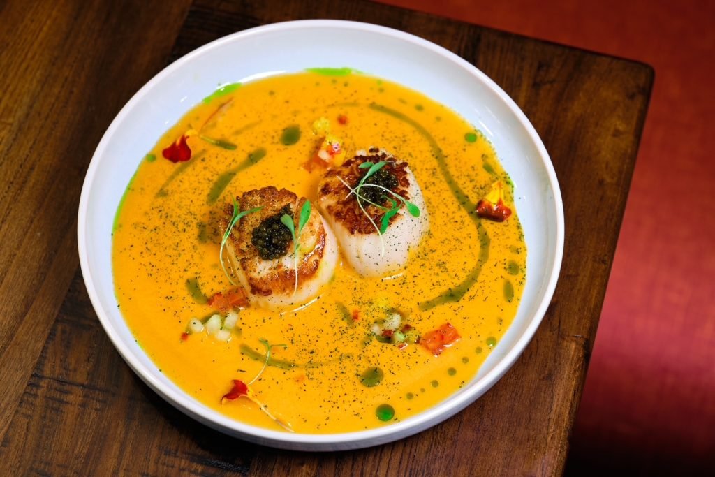 Seared scallops in a chilled tomato gazpacho