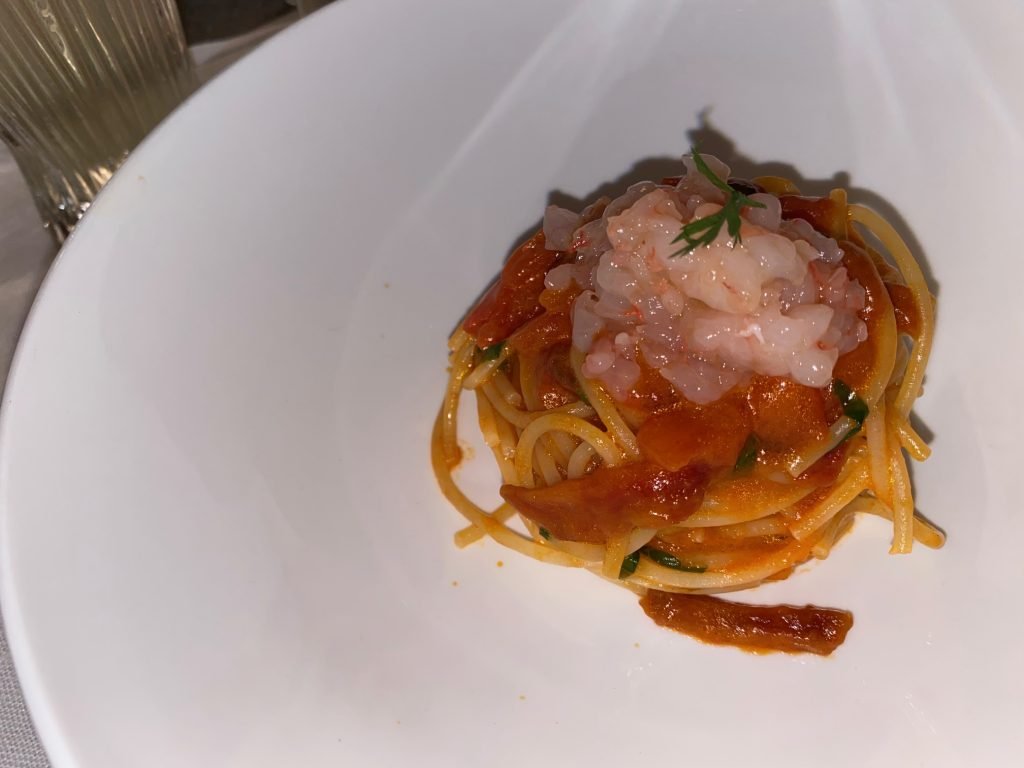 A nest of fresh pasta with a shellfish sauce