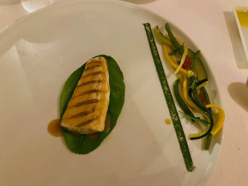 A fish course with confit vegetables