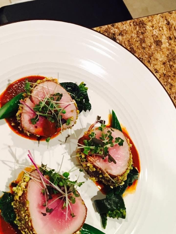Pork loin with greens and a red wine reduction