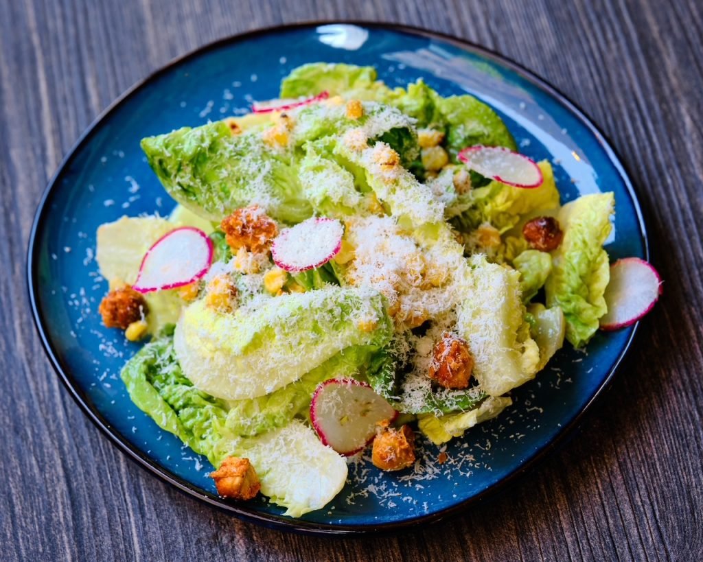 A chopped salad with radish and crisp chickpeas
